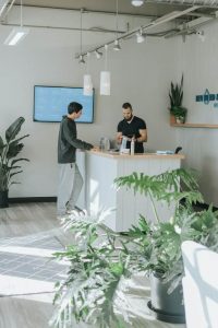 Man signing into visitor management system
