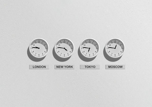 four clocks on a wall